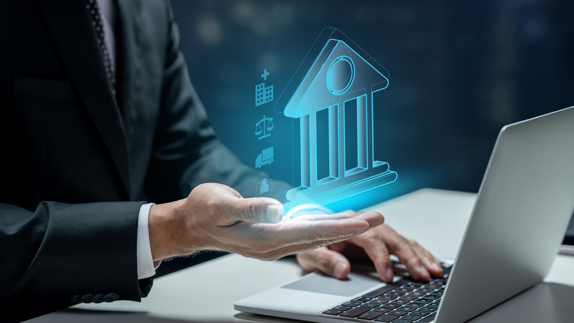 Businessman using a laptop while showing a government icon. Technology innovation on a virtual screen. Concept of public sector governance